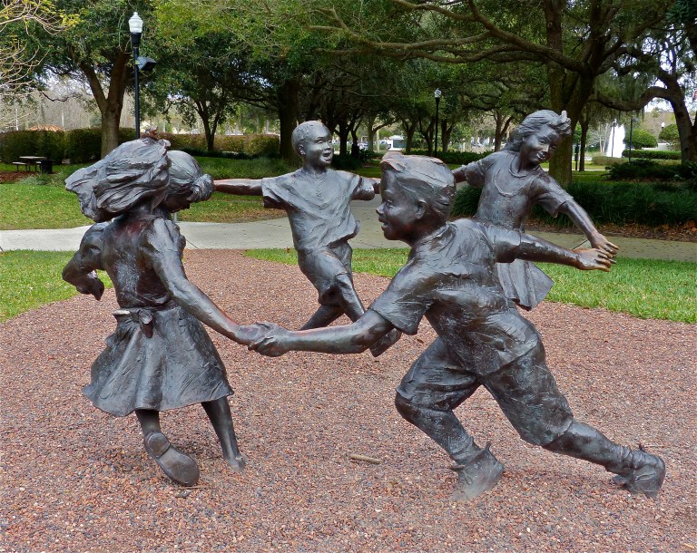 Joyful children delight visitors at cultural center. 