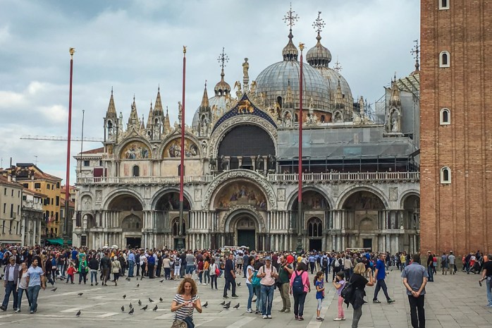 St. Mark's Square and Basilica, where the tourists and pigeons compete for space.